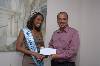 Photo 9 (484Wx324H) - Sara presents 3rd Place Winner, John Pringle, with his 6 months prize membership to Spartan Health Club 
